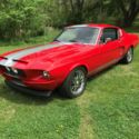 1968 red with silver stripe Ford Mustang thumbnail