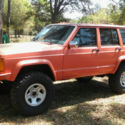 1990 Orange Jeep Cherokee thumbnail