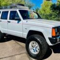 1990 White Jeep Cherokee thumbnail