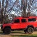 1989 Torch Red Land Rover Defender thumbnail