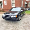 1989 Black Ford Taurus thumbnail