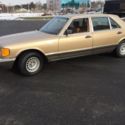 1985 Gold Mercedes-Benz 500-Series thumbnail