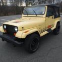 1990 Yellow Jeep Wrangler thumbnail