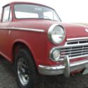 1965 Red Datsun Pickup thumbnail