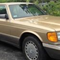 1986 Gold Mercedes-Benz 400-Series thumbnail
