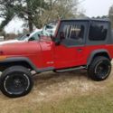 1993 Red Jeep Wrangler thumbnail