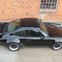 1976 Black Porsche 911 thumbnail
