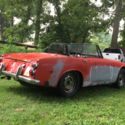 1966 Red Datsun Roadster thumbnail