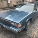 1986 Blue Cadillac DeVille thumbnail