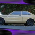 1979 Tan Datsun 210 thumbnail