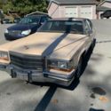 1989 Tan Cadillac Brougham thumbnail