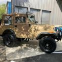 1955 Tan Willys Jeep thumbnail